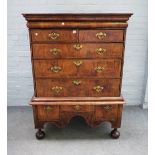 An early 18th century figured walnut chest on stand,