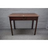 A mid-18th century mahogany rectangular single drawer writing table, on canted square supports,