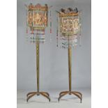 A pair of unusual and decorative standard lamps,