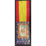 A Tibetan thangka depicting an arhat, 20th century, pigment with gold on cloth,