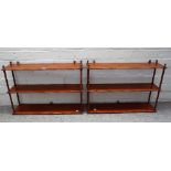 A pair of 19th century mahogany open hanging three tier shelves with turned supports,