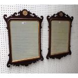 A pair of George III style parcel gilt mahogany fret cut mirrors with bevelled plates,