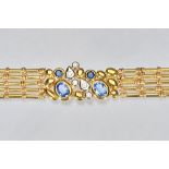 An Italian gold, sapphire and diamond bracelet, the centre collet set with two oval cut sapphires,