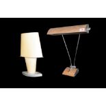 A 1950s painted tin and chrome table lamp with faux wood finish and adjustable shade,