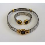 A Bvlgari gold and steel collar necklace, the front mounted with an ancient coin,