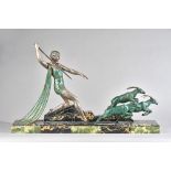 An Art Deco figural group, painted spelter on a marble plinth, signed 'J.