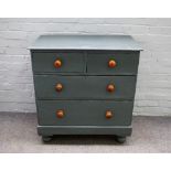 A 19th century later grey painted chest of two short and two long drawers, on bun feet,