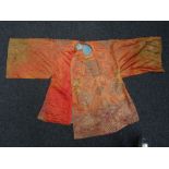 A Chinese orange-ground robe, late19th/20th century,