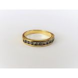 A 9ct gold and diamond half hoop eternity ring,