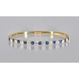 An 18ct gold, sapphire and diamond oval hinged bangle,