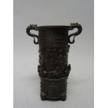 A Chinese Yuan style bronze two-handled vase, Ming dynasty, of cylindrical form with dragon handles,