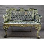 A 20th century green and white painted cast iron garden bench with interlaced arch back on scroll