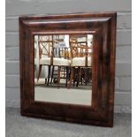 A Queen Anne oyster veneered cushion frame wall mirror with later bevelled plate,