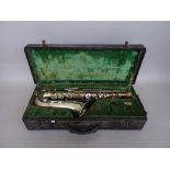 A Besson & Co 'prototype' Euphonium in a hard case and a Douchet & Co silver plated saxophone,
