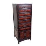 An early 20th century Chinese hardwood and burr wood bank of seven drawers over cupboards, pre-1918,