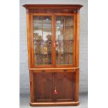 An early Victorian mahogany floor standing corner display cabinet/cupboard with pair of astragal