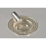 A silver ashtray, the side applied with a cast model of a lit cigar,