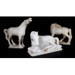 A group of four 20th century white marble Asian style models of horses in varying poses,