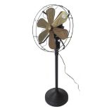 A 1950s style electric fan with gilt metal blades and an ebonised metal body, 110cm high.