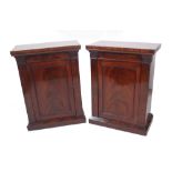 A pair of Regency and later mahogany single door side cabinets, 60cm wide x 36cm deep x 85cm high.