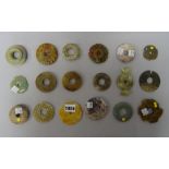 A group of fourteen Chinese archaistic jade bi discs,