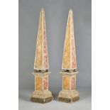 A pair of late 19th century faux marble painted obelisks on stands,