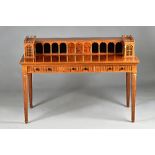 David Linley; a walnut and mahogany writing table of architectural Carlton House form,