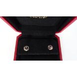 A Cartier pair of white gold Love pattern earstuds, each of circular form, with a screwhead motif,