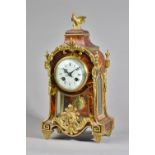 A FRENCH ORMOLU-MOUNTED TORTOISESHELL MANTEL CLOCK In the Regence style,