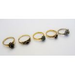 A diamond set cluster ring mounted with circular cut diamonds, between split shoulders,