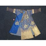 A Chinese embroidered blue- ground dragon robe, 19th century,