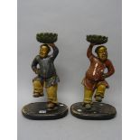 A pair of Chinese painted and gilt wooden figures of the Hehe Erxian twins, 19th century,