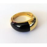 A Cartier 18ct gold and black onyx ring, in a raised bombe design, detailed Cartier London 47763,