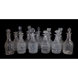 Eight pairs of cut and moulded glass decanters and stoppers,
