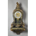 A FRENCH ORMOLU-MOUNTED TORTOISESHELL AND CUT BRASS INLAID 'BOULLE' BRACKET CLOCK AND BRACKET In
