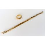 A gold bracelet, in a faceted curb link design, on a snap clasp, detailed 14K 585,