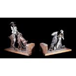 A pair of hardwood and steel bookends modelled as figures on horseback, 33cm wide.