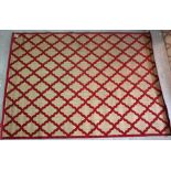 Feizy Rugs; two 20th century red patterned indoor/ outdoor carpets with geometric pattern,