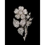 A diamond brooch, designed as a floral spray, mounted with cushion shaped and rose cut diamonds,