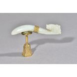 A Chinese jade belt hook, carved with dragon head terminal, the stone of greyish white tone,