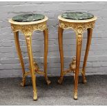 A pair of 18th century style limed oak occasional tables with circular inset marble tops on