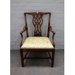 A mid-18th century mahogany carver chair, with pierced splat on canted block supports,