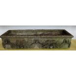 A set of four rectangular reconstituted stone planters with swag decoration, 91cm wide x 21cm high,