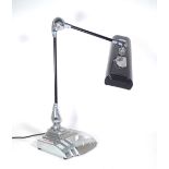 Flexo; a 20th century Art Deco style anglepoise desk lamp with polished steel base,