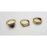 An 18ct gold sapphire and diamond set cluster ring, a 9ct gold and diamond set ring,