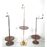 Three similar tubular metal standard lamps with adjustable anglepoise arm,
