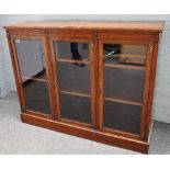 A Victorian walnut floor standing bookcase with three glazed doors, 153cm wide x 117cm high.