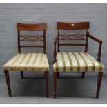 A set of ten late George III style inlaid mahogany dining chairs,