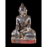 A modern Asian composite stone figure of a seated Buddha, 49cm high.
