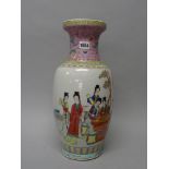 A Chinese famille-rose baluster vase, painted with young women at leisure,